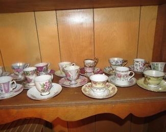 DOZENS OF DEMITASSE CUP AND SAUCERS.