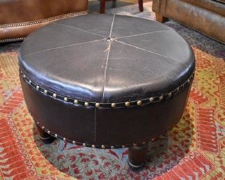 Round leather ottoman