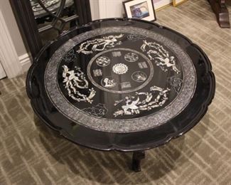 Interesting vintage mother of pearl inlaid table, the legs fold under to become a table top tray
