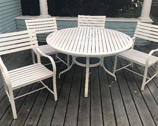White metal patio set: 49” diameter table + 4 chairs. Super sturdy. Not shown: patio umbrella & metal base