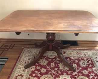 Antique English tilt-top breakfast table from Regency period, circa 1820 (57”L, 41”D, 27.5”H)