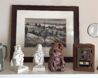 Wedgwood green jasperware pitcher, monkey bookends, carved hardstone vase, bank made from old post office box, brass magnifier. In back: “Along the Hudson”, print by Arnold Blanch (pencil signed in lower right) 