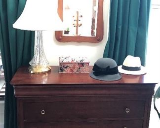 4 drawer chest by Shermag (46”L, 19”D, 33”H), crystal & brass lamp, antique wall mirror, hats