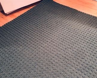 10 x 14 ft. forest green waffle pattern area rug by Fabrica (dark areas at edges are shadow)