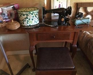 Singer vintage sewing machine in cabinet