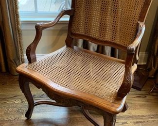 46. Carved Wood Frame Cane Arm Chair (27" x 21" x 36")