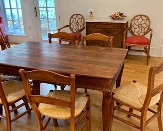 Rosewood dining table and rush seat chairs.