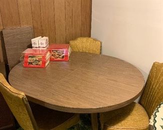 Formica table with six chairs and two leaves