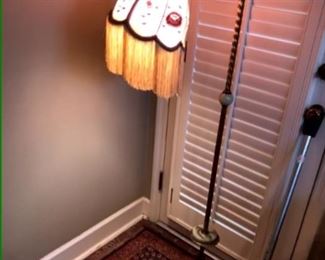 Vintage floor lamp with silk fringed shade.