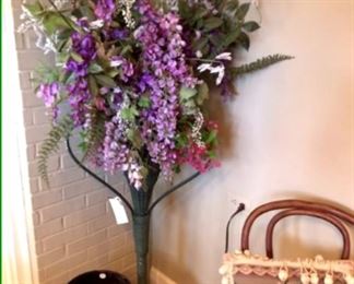 Beautiful silk arrangement in an antique wicker stand.