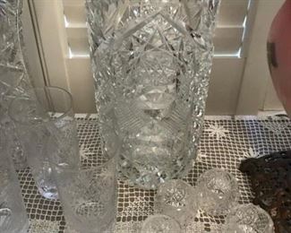 Beautiful cut glass vase along with other crystal pieces