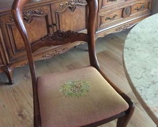 Antique chair with embroidered seat