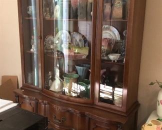 China cabinet, full of collectibles like Hull, McCoy pottery and more