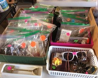 What nots-all bagged up- could include:  pins, buttons, rocks, bolo ties, religious items, marbles, jewelry, money clips, tools, office items, souvenirs, and more