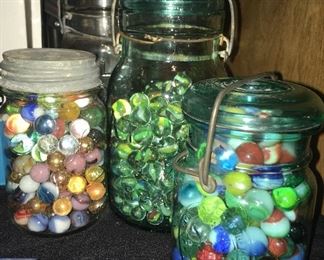 Various vintage marbles in vintage canning jars