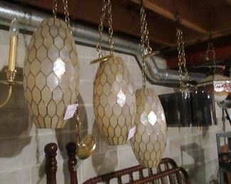 a trio of vintage Capiz shell pendant lamps