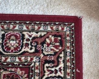 2 matching Burgandy rugs