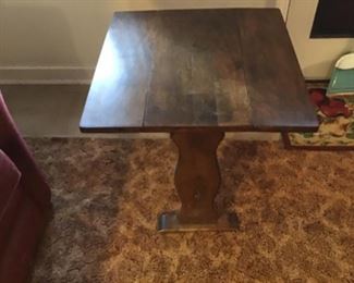 A small unique vintage drop leaf side table 