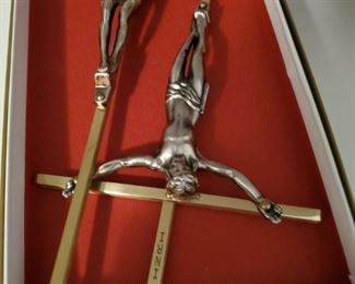 Crucifixes?  No comments made. I will not be smited.  Or whatever that word is when you make a religious comment.  Smited?  Somebody please correct me because I am a God Fearing man and do not want to go to the NO NO place when my untimely demise arrives.  Amen.  