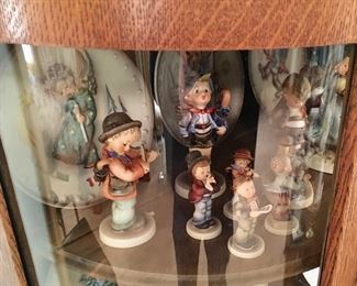 LOTS OF HUMMELS, THERE ARE FIGURINES, PLATES, AND OTHER HUMMEL ITEMS