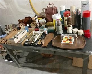 INDUSTRIAL METAL DESK SHOWING VINTAGE PICNIC ITEMS, THERMOS, ETC.