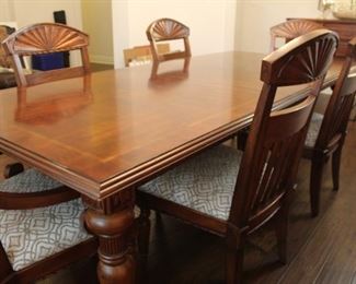 Haverty's Cherrywood table and 6 chairs, 96" x 43" with one leaf inserted (shown). Includes additional 16" leaf.