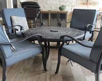 Patio table and chairs - table has a fire bowl in the middle