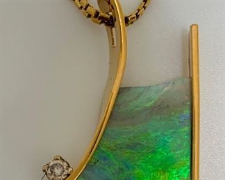 5 carats of Australian black opal with .03 diamond in 14kt yellow gold pendant.