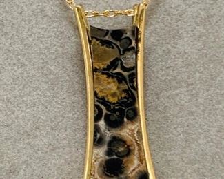 Leopard skin jasper and a .02 ct diamond set in a  14kt yellow  gold pendant.