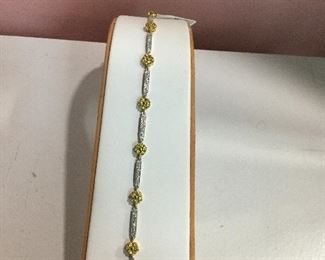 White gold, diamond and yellow sapphire bracelet