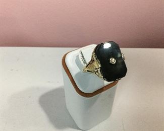 Yellow gold, onyx and diamond ring