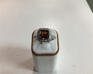 White gold, garnet and diamond ring