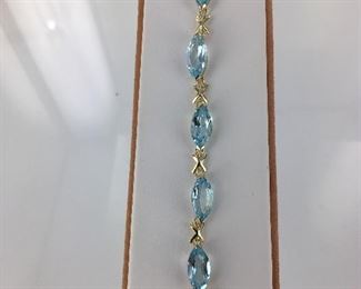 Yellow gold and blue topaz bracelet