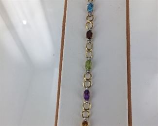 Yellow gold, multi colored gemstone bracelet