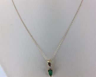 Yellow gold emerald necklace