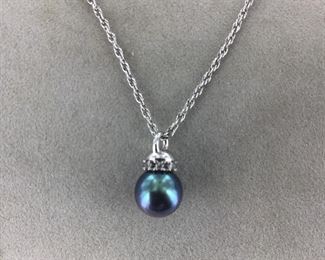 Tahitian Black Pearl and Diamond pendant in 14 Kt White gold.