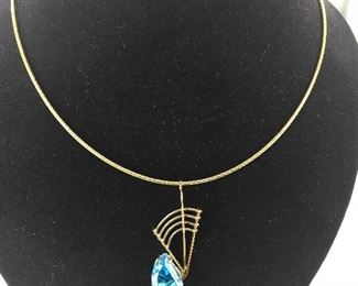 Swiss Blue Topaz set in a 14 Kt White and Yellow Gold Pendant.