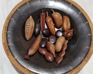 This highly decorative bowl has African stones and nuts inside.