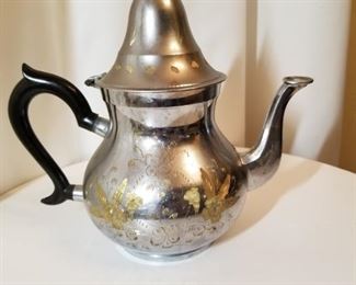 Tea pot with brass embellishment