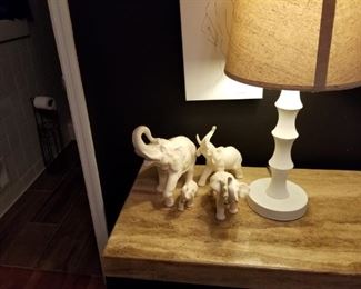 Elephants, smaller desk lamp matches tall on, marble top table, one other one same size, also 9 chest of drawers w/ marble top in another photo