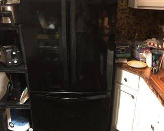 Whirlpool refrigerator, freezer on bottom.