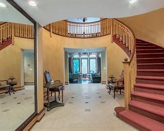 Foyer - pair of quilted leather chairs, occasional tables