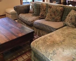 Leather and upholstered sectional, wood coffee table, geometric area rug