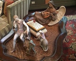 Lladros, Oriental rug, leaather and woven top coffee table