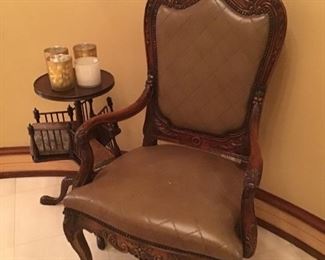 One of a pair of quilted leather chairs