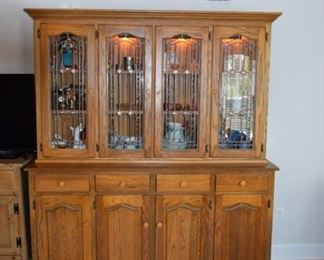 Solid Oak Lighted Hutch Amish Style 2 Piece. Base 68 1/2" W X 36" T X 20" D. Top is 65 1/2" W X 42 1/2" T X 12" D  with Bead Board Back Leaded Glass Art