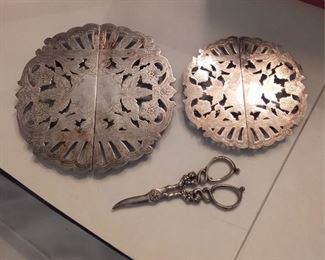 Sterling Grape Shears And 2 Silver Plated Trivets
Lot #: 55