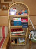 Games and wicker shelf unit