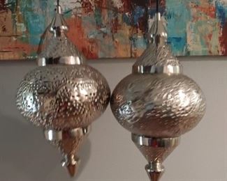 Matching silver hanging lights. Work perfectly fine. Opens from top and bottom in order to change the light or alter to remove bottom and become decorative table piece. 