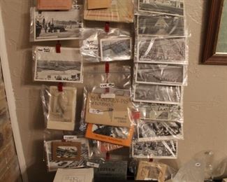 WW2 Post Cards and a WW2 pin with a Helmet on it.